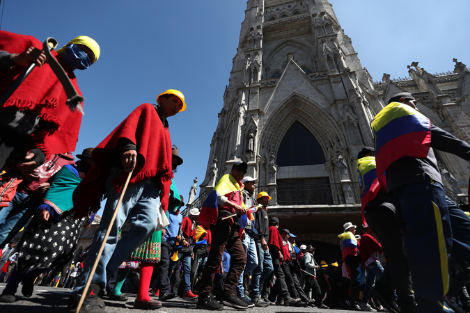 Indigenous people protest in the streets of Quito (Ecuador)