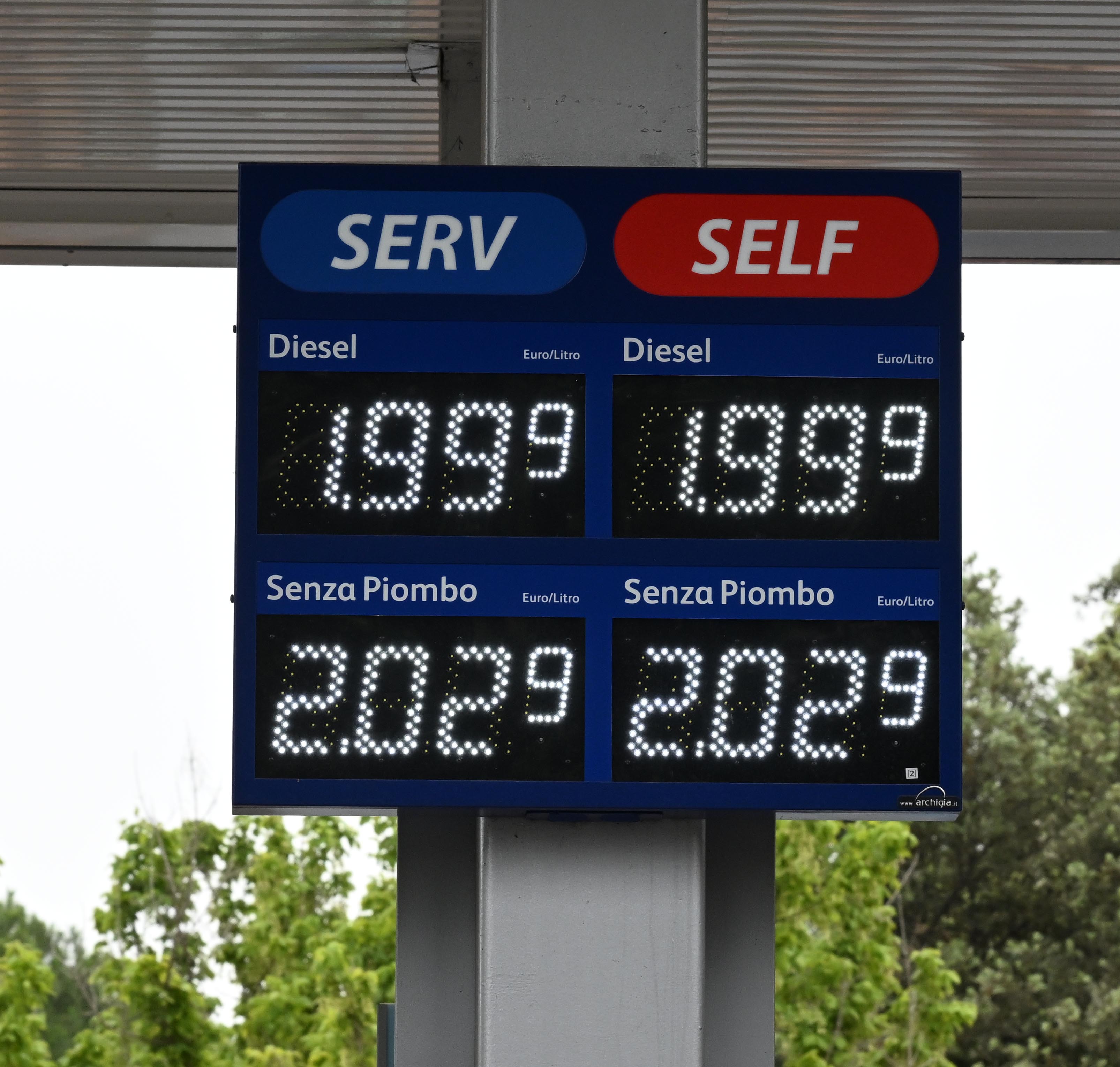 Gasoline and diesel prices are displayed near a gas station in Rome, Italy, June 23, 2022.