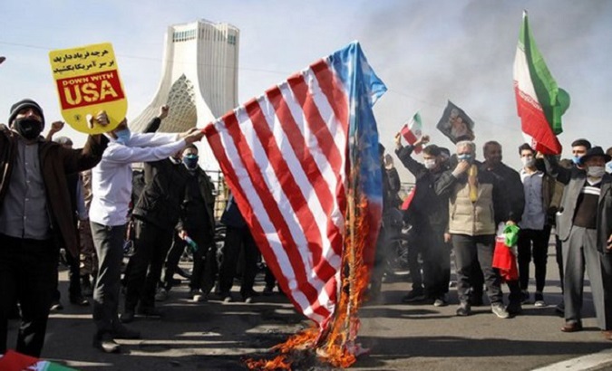File photo of Iranians burning a flag of the United States in Tehran.