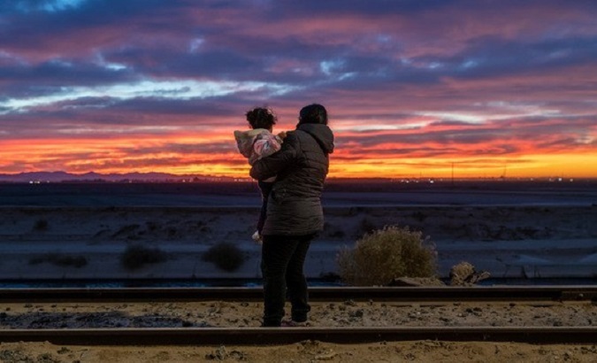 A migrant and her child at the U.S.-Mexico border.