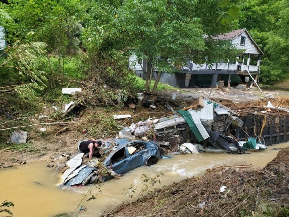Photo taken on July 30, 2022 shows a house and vehicles destroyed by heavy rain-caused flooding in Central Appalachia in Kentucky, the United States.