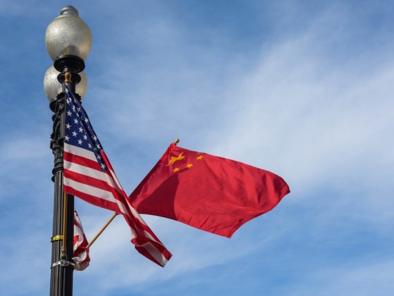 Photo taken on Sept. 24, 2015 shows the national flags of China (R) and the United States as well as the flag of Washington D.C. on the Constitution Avenue in Washington