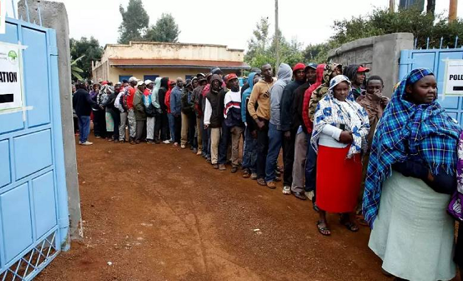 File photo of Kenyans lining up to vote in a polling station, 2017.