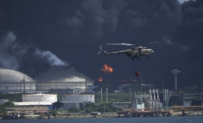 Army carrying water to extinguish the fire at the Supertanker Base, Matanzas, Cuba, Aug. 8, 2022.