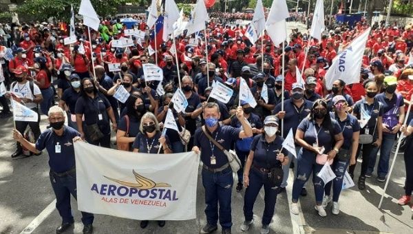 Workers demand the return of the CONVIASA plaine, Caracas, Venezuela, Aug. 9, 2022.