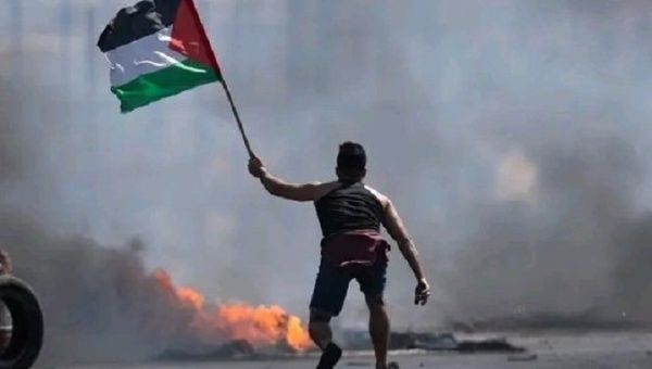 A man holds a Palestinian flag, Aug. 8, 2022.