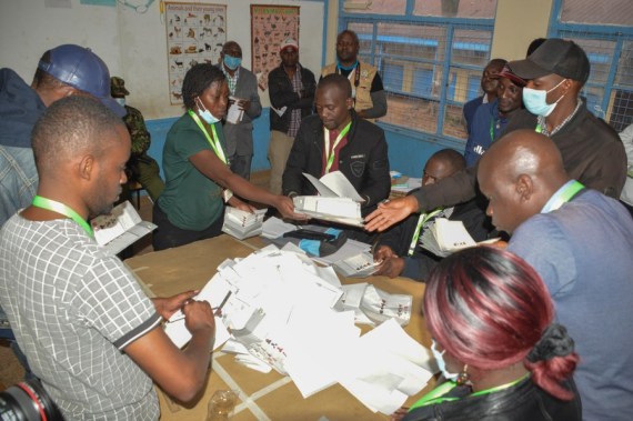 Kenya's Independent Electoral and Boundaries Commission officials count votes by displaying to agents at a polling station in Nairobi Aug. 9, 2022.