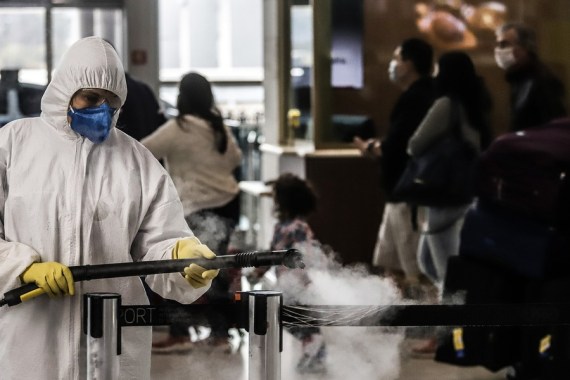 A staff member disinfects the Guarulhos International Airport on the outskirts of Sao Paulo, Brazil, July 30, 2020.