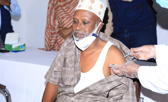 A man receives a COVID-19 vaccine, Mogadishu, Somalia, 2021.