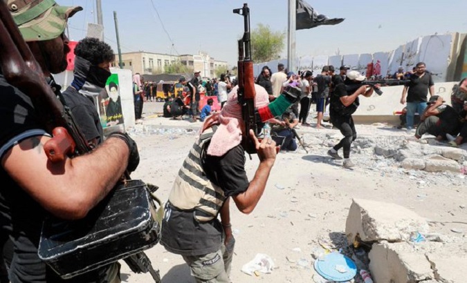 Civilians fight in the streets of Baghdad, Aug. 30, 2022.