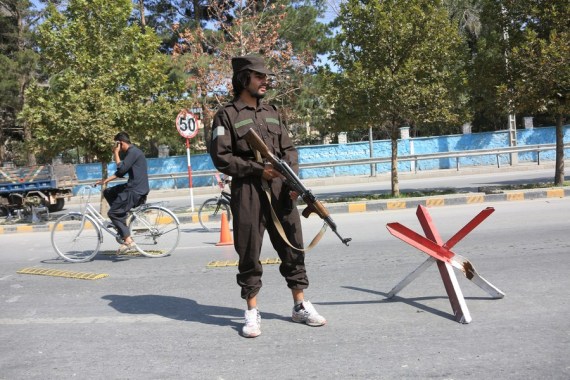Afghan security force member stands guard near the site of a blast in Kabul, Afghanistan, Sept. 5, 2022.