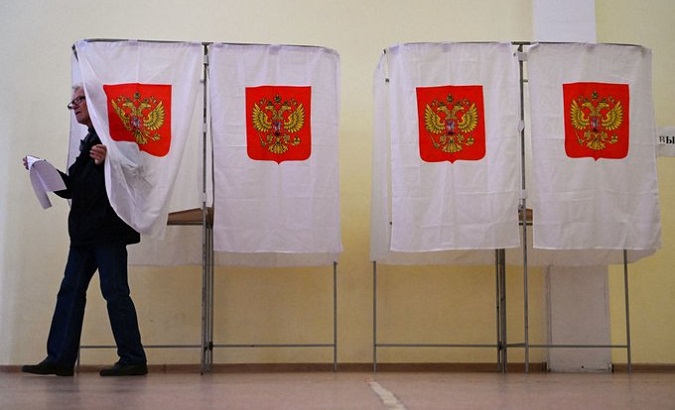Russian citizen casting his vote, Sept. 2022.