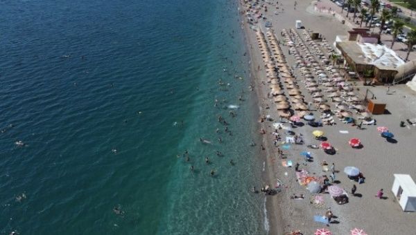People enjoy time on the beach in Antalya, Türkiye, on Sept. 11, 2022. 