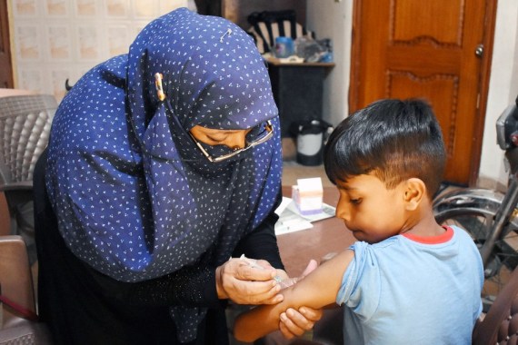 A boy receives a dose of COVID-19 vaccine in Lahore, Pakistan, Sept. 20, 2022.