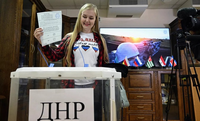 A citizen participates in the referendum of accession to Russia, Sept. 2022.
