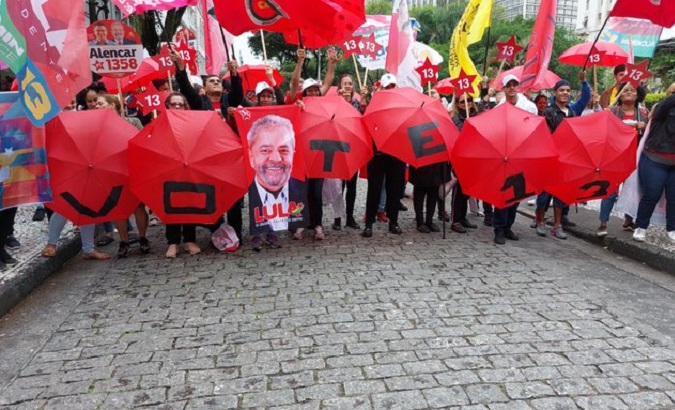 Brazilians walk the streets asking for the vote for Lula da Silva, Sept. 29. 2022.