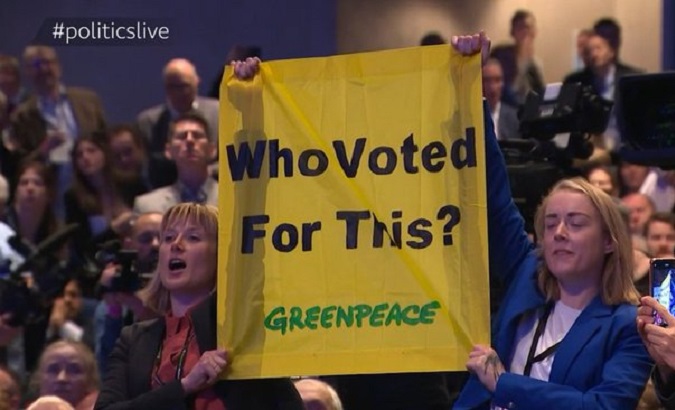 Greenpeace activists in Birmingham, U.K, Oct. 5, 2022.