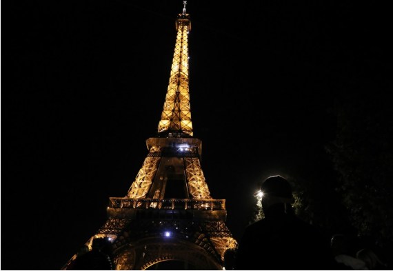 A man looks at the sparkling Eiffel Tower in Paris, France, Sept. 22, 2022.