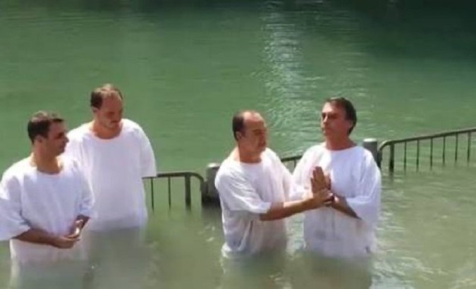 Jair Bolsonaro (R) getting baptized in the Jordan River, 2016.