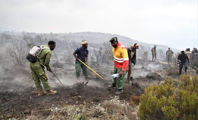 Firefighters battling to contain a fire on Mount Kilimanjaro, Tanzania, Oct. 12, 2020.