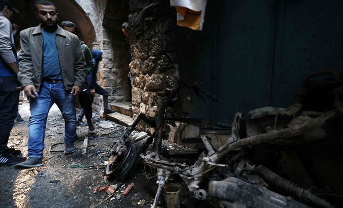 People inspect the damage after the Israeli raid, Nablus, Oct. 24., 2022.