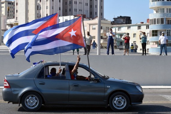 People take part in a caravan in Havana, Cuba, on March 28, 2021.