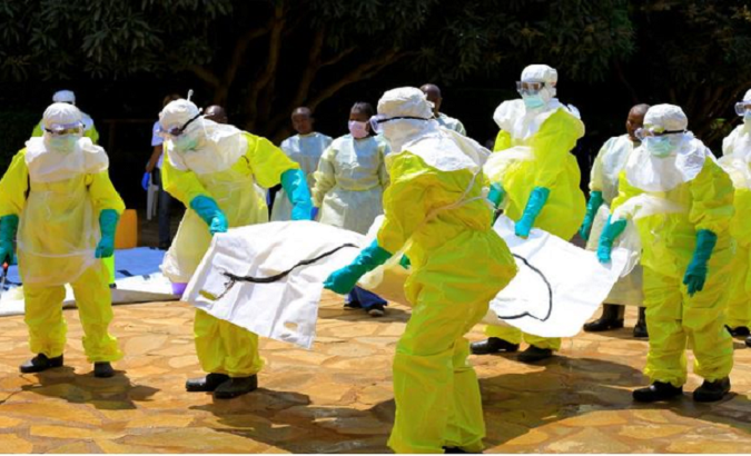 File photo of health workers picking up a suspected Ebola case, South Africa.