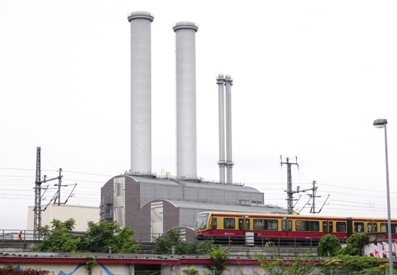 A train passes a thermal power plant in Berlin, Germany, Sept. 8, 2022.