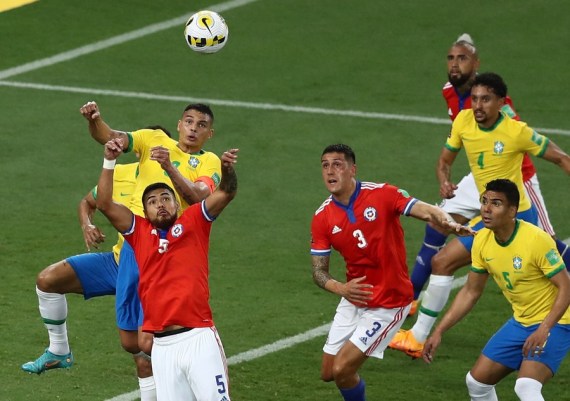 Thiago Silva (top L) of Brazil vies for a header during the 2022 FIFA World Cup qualifier between Brazil and Chile in Rio de Janeiro, Brazil on March 24, 2022.