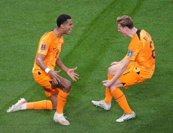Cody Gakpo (L) of the Netherlands celebrates scoring with Frenkie de Jong during their Group A match at the 2022 FIFA World Cup at Al Thumama Stadium in Doha, Qatar, Nov. 21, 2022.