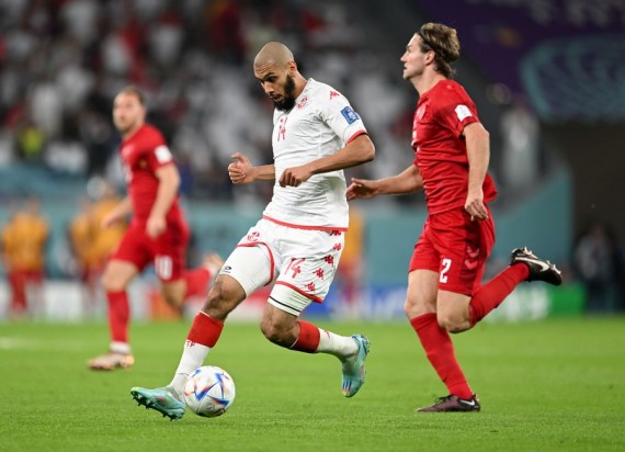 Aissa Laidouni (L) of Tunisia controls the ball during the Group D match against Denmark at the 2022 FIFA World Cup at Education City Stadium in Al Rayyan, Qatar, Nov. 22, 2022.