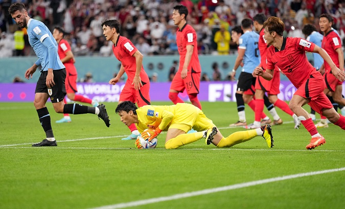 South Korean goalkeeper Kim Seung-gyu makes a save, Al Rayyan, Qatar, Nov. 24, 2022.