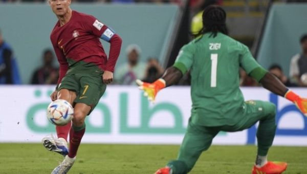 Cristiano Ronaldo (L) of Portugal shoots during the Group H match against Ghana at the 2022 FIFA World Cup at Ras Abu Aboud (974) Stadium in Doha, Qatar, Nov. 24, 2022.