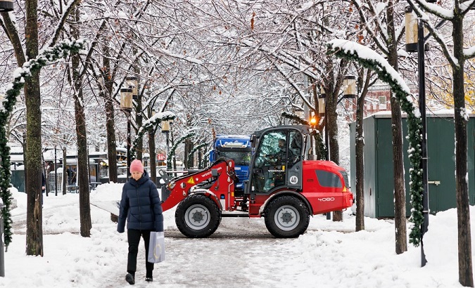 A snowplow clears the road in Stockholm, Sweden, Nov. 21, 2022.