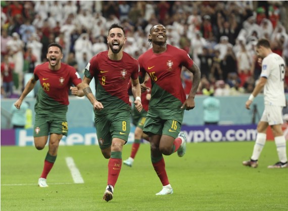 Bruno Fernandes (2nd L) of Portugal celebrates his penalty goal during the Group H match against Uruguay at the 2022 FIFA World Cup at Lusail Stadium in Lusail, Qatar on Nov. 28, 2022.