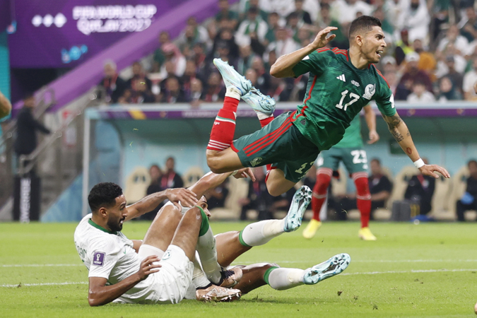 Orbelin Pineda of Mexico falls today, in a group stage match of the Qatar 2022 Soccer World Cup between Saudi Arabia and Mexico at the Lusail stadium (Qatar)