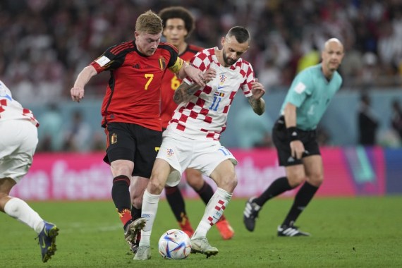 Kevin De Bruyne (L) of Belgium vies with Marcelo Brozovic of Croatia during their Group F match at the 2022 FIFA World Cup at Ahmad Bin Ali Stadium in Al Rayyan, Qatar on Dec. 1, 2022.