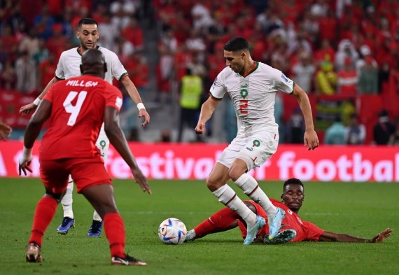 Achraf Hakimi (2nd R) of Morocco vies for the ball during the Group F match against Canada at the 2022 FIFA World Cup at Al Thumama Stadium in Doha, Qatar on Dec. 1, 2022.