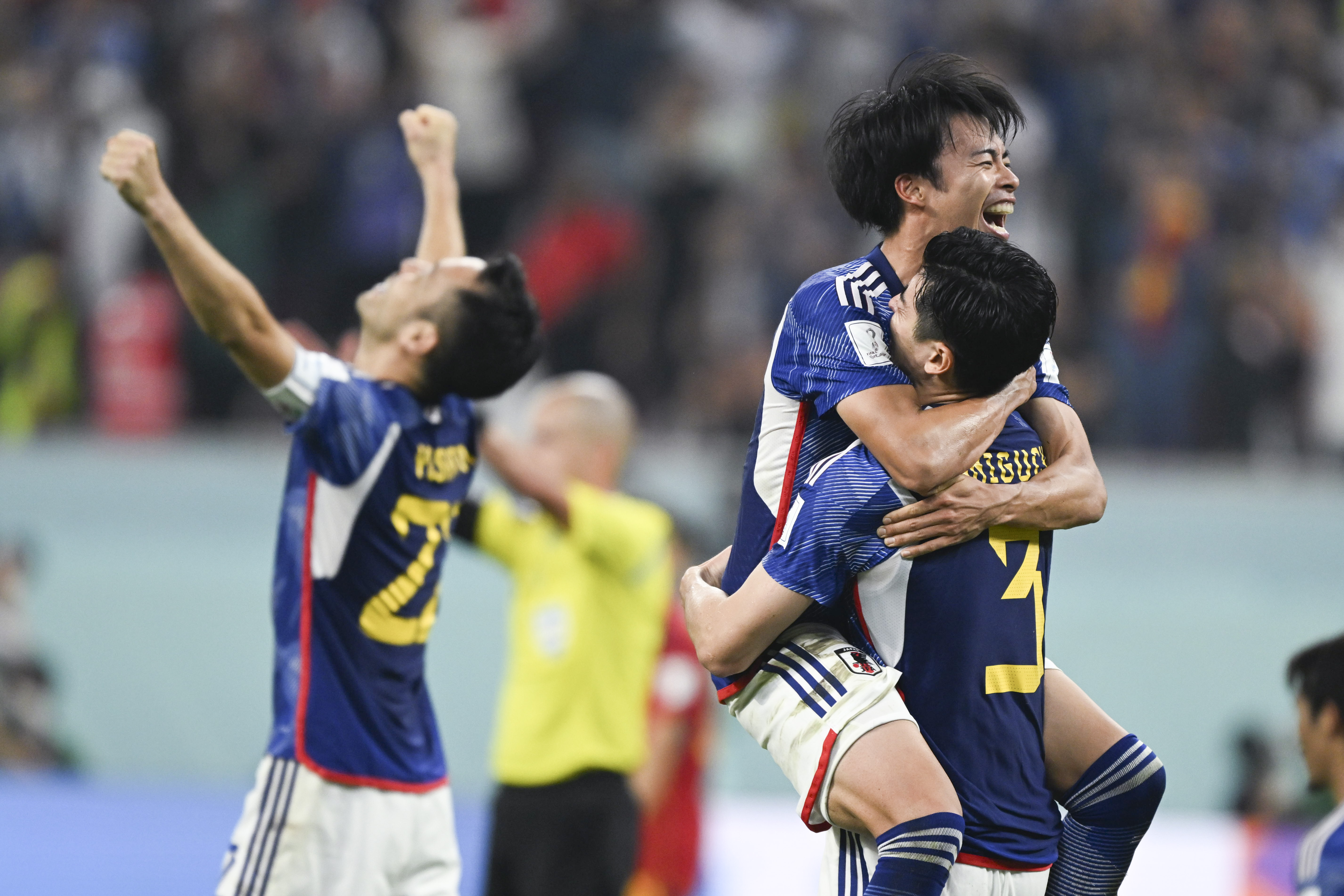 Players of Japan celebrate after the Group E match between Japan and Spain at the 2022 FIFA World Cup at Khalifa International Stadium in Doha, Qatar, Dec. 1, 2022.