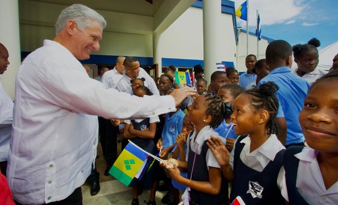 Cuba's President Miguel Diaz-Canel (L) meets with Vincentian students, Dec. 4, 2022.