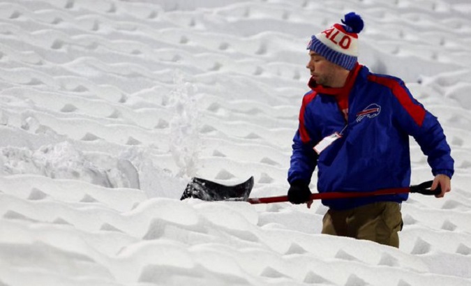 A man clears accumulated snow, U.S., Dec. 22, 2022.