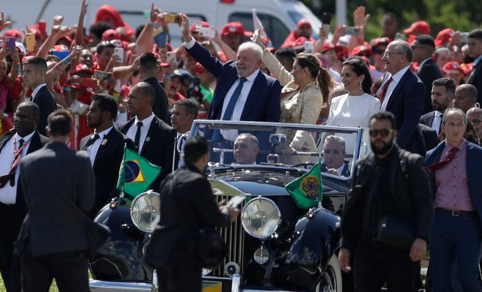 President Lula da Silva (C), Vice President-elect Geraldo Alckmin as well as their wives take a convertible in Brasilia, Brazil, Jan. 1, 2023.
