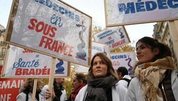 Doctors hold banners demanding better income and working conditions, Paris, France, January 2023.