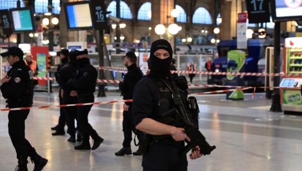 Police officers patrol the Gare du Nord train station after the knife attack, Paris, France, Jan. 11, 2023.