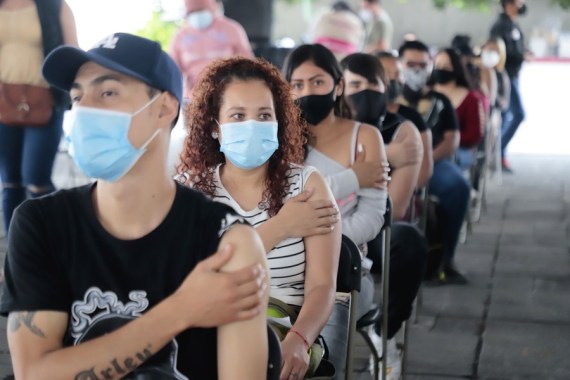 People wait at the observation area after receiving COVID-19 vaccines, in Nezahualcoyotl, Mexico, on Aug. 19, 2021.