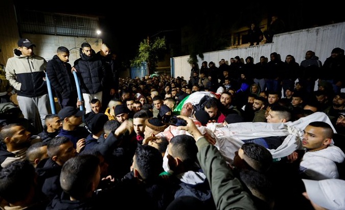 Mourners carry the bodies of two Palestinians, Jenin, Jan. 19, 2023.