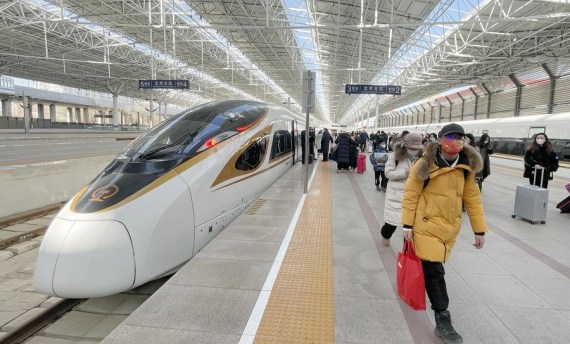 Passengers arrive at Beijing North Railway Station in Beijing, capital of China, Jan. 26, 2023.