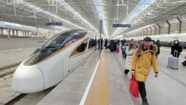 Passengers arrive at Beijing North Railway Station in Beijing, capital of China, Jan. 26, 2023.