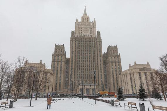 People walk near the building of the Russian Foreign Ministry in Moscow March 28, 2022.