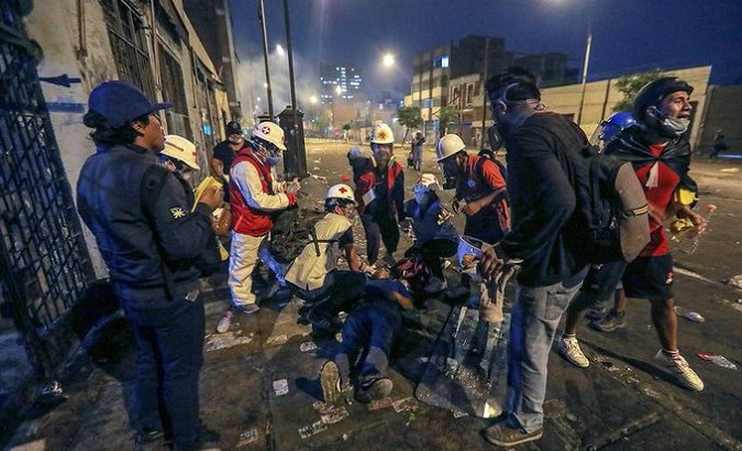 Peruvian paramedics assist a citizen who was shot by police, Jan. 28, 2023.